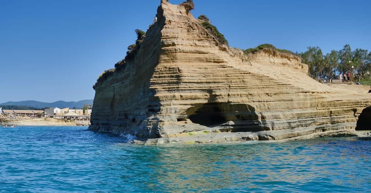 Sidari Self-Drive Boat: Fuel, Deposit and the Fifteen-Minute Test 3 Layered sandstone formation at Canal d'Amour viewed from the water