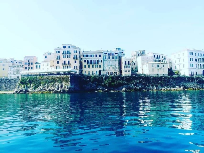 Private Yacht from Corfu Town: What Each Extra Hour Changes 2 Corfu Town waterfront buildings seen from a private boat
