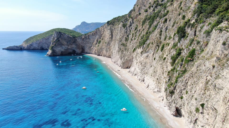 Paleokastritsa Caves and Stelari Beach: Most of This Boat Trip Is Ashore 2 Long pale pebble beach below steep cliffs on the west coast