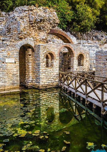 Corfu to Albania Day Trip: Passport, Port and Butrint Options 3 Historic stone structure beside water at Butrint National Park